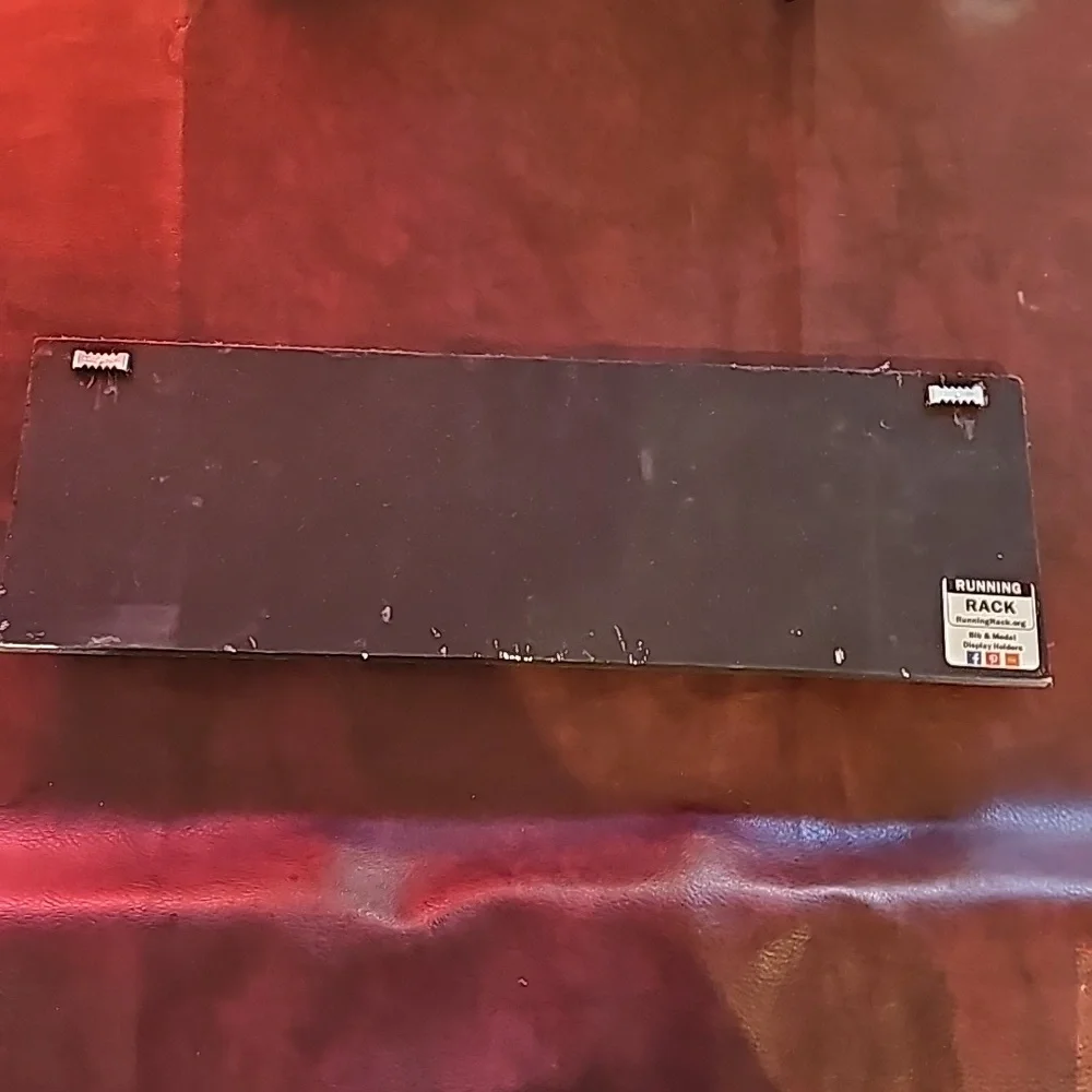 Black medal holder sign